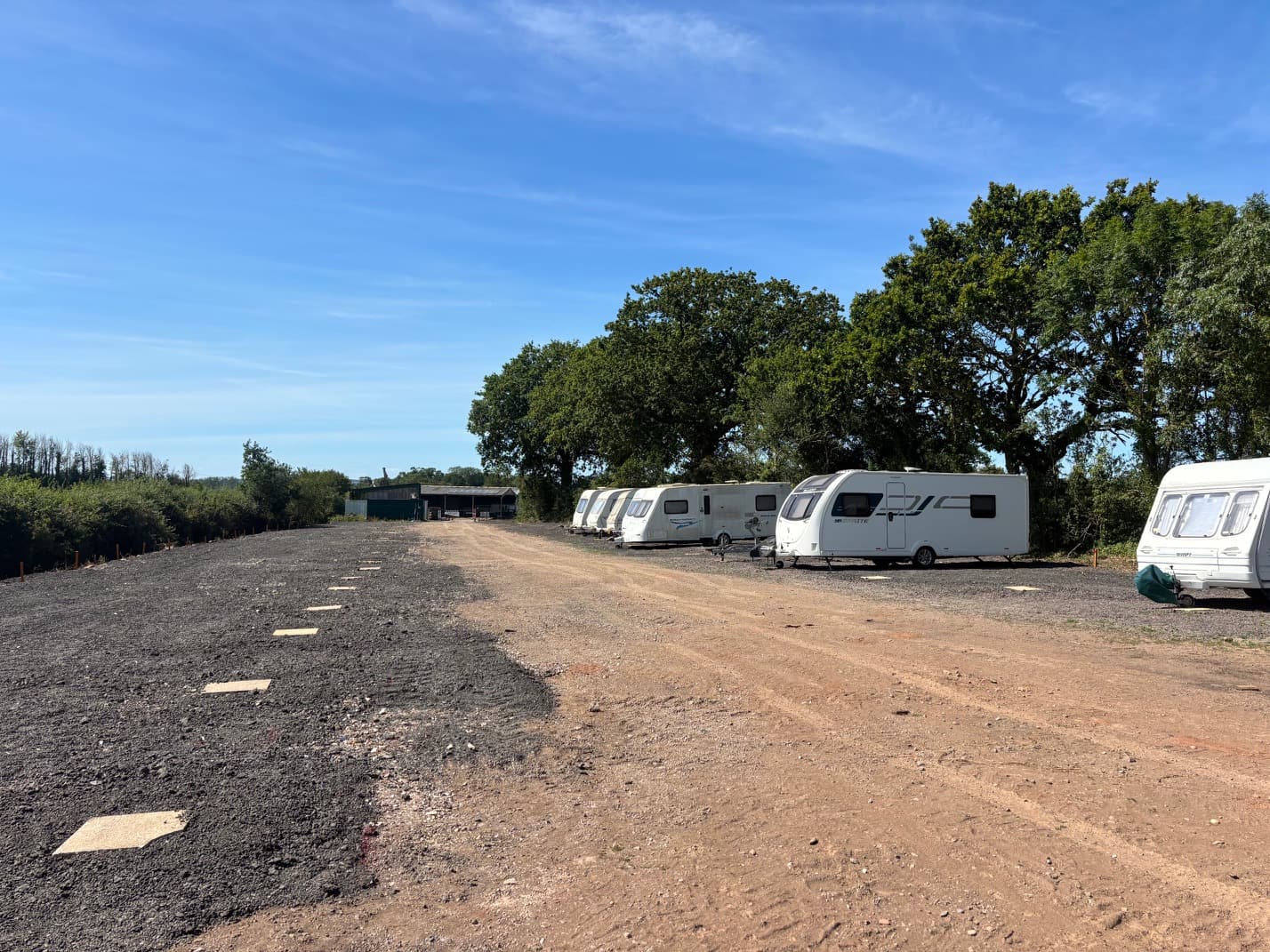 Row of caravans on hardstanding pitches