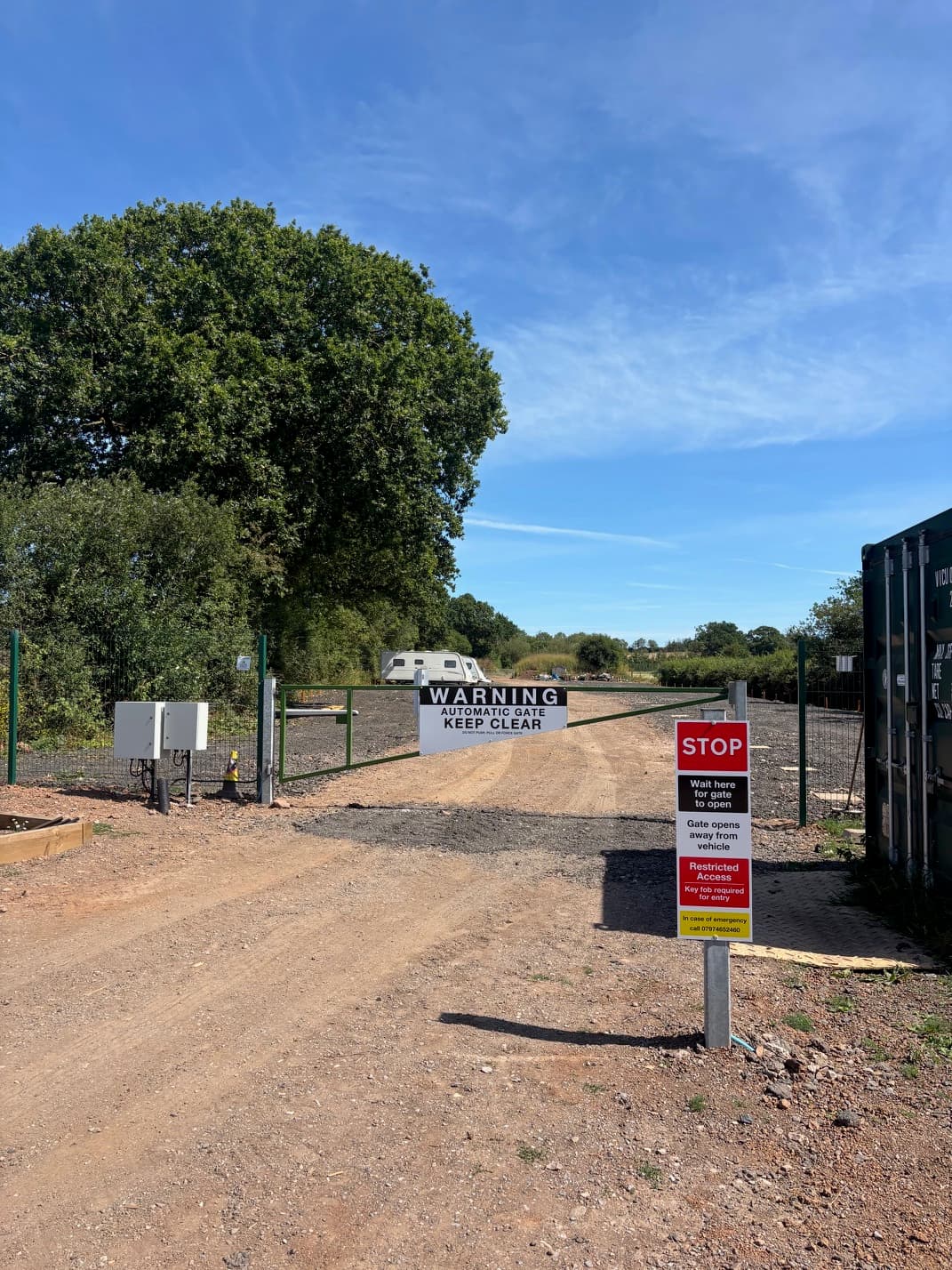 Automatic gate entry with signage — key fob required